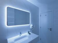 a white bathroom with a sink and a mirror at Lutecia Smart Design Hotel in Lisbon