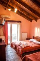 Posteľ alebo postele v izbe v ubytovaní Filippion Hotel