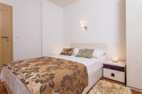 Postel nebo postele na pokoji v ubytování Apartments Žuvela