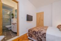 Postel nebo postele na pokoji v ubytování Apartments Žuvela
