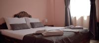 a bedroom with a bed with towels on it at Hotel &quot;VIR&quot; in Velika Plana