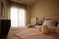 Posteľ alebo postele v izbe v ubytovaní Keramoti Luxury Apartments