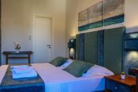 Postel nebo postele na pokoji v ubytování Hotel Dionysis Studios