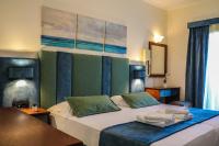 Postel nebo postele na pokoji v ubytování Hotel Dionysis Studios