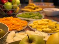 a table topped with plates of fruits and vegetables at Hotel Ritual Torremolinos- Adults Only in Torremolinos