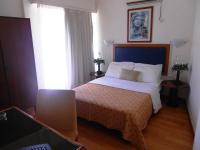 Posteľ alebo postele v izbe v ubytovaní Adams Hotel