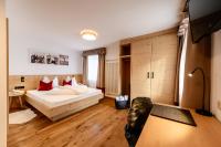 A bed or beds in a room at Boutique Hotel Eggele