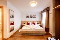 A bed or beds in a room at Boutique Hotel Eggele