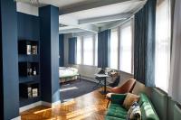 a living room with a couch and a bedroom at ABode Manchester in Manchester