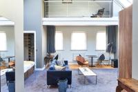 a living room with a couch and a table at ABode Manchester in Manchester