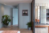 A bed or beds in a room at Perianth Hotel