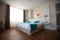 Postel nebo postele na pokoji v ubytování Hotel Villa Rosario, Palacete
