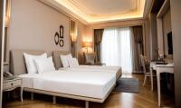 Postel nebo postele na pokoji v ubytování Lazzoni Hotel