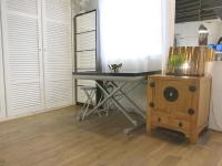 a desk in a kitchen with a table and a chair at Studio Marais Charlot CityCosy in Paris