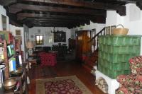 a living room with a couch and a table at Ferienhaus Himmelreichmühle in Rettenberg