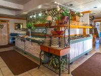 een keuken met een aanrecht met borden en borden bij Days Inn by Wyndham Clinton in Clinton