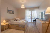 Posteľ alebo postele v izbe v ubytovaní Ambria Apartments Dune
