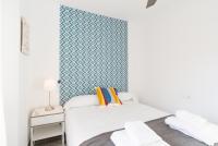 A bed or beds in a room at Berlanga, apartamento en el centro