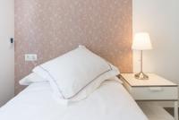 A bed or beds in a room at Berlanga, apartamento en el centro