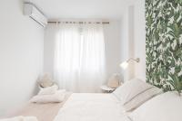 A bed or beds in a room at Berlanga, apartamento en el centro
