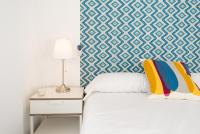 A bed or beds in a room at Berlanga, apartamento en el centro