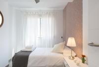 A bed or beds in a room at Berlanga, apartamento en el centro