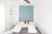 A bed or beds in a room at Berlanga, apartamento en el centro