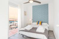 A bed or beds in a room at Berlanga, apartamento en el centro