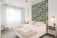 A bed or beds in a room at Berlanga, apartamento en el centro