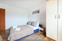 Łóżko lub łóżka w pokoju w obiekcie Villa Smilje ZadarVillas