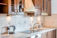 Kuchyňa alebo kuchynka v ubytovaní Apartamenty Zdrojowa