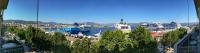 a harbor with several ships docked in the water at Hotel le Dauphin in Ajaccio