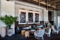 a living room with a blue couch and chairs at Unico Hotel Riviera Maya Adults Only in Akumal