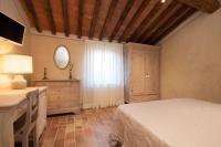 Posteľ alebo postele v izbe v ubytovaní Le Camere Del Borgo