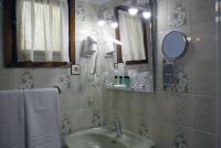 a bathroom with a sink and a mirror at Casa Rural Priena in Covadonga