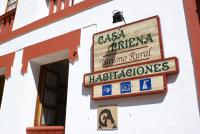 a sign for a restaurant on the side of a building at Casa Rural Priena in Covadonga