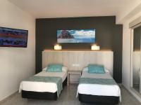 A bed or beds in a room at Hostal Cervantes