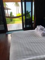 Postel nebo postele na pokoji v ubytování Itsara bungalow