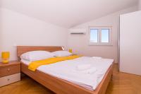 Postel nebo postele na pokoji v ubytování APARTMENT ABA