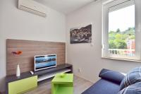 TV a/nebo společenská místnost v ubytování Bretia Apartments