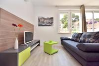 TV a/nebo společenská místnost v ubytování Bretia Apartments
