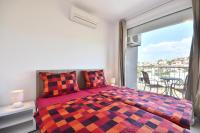 Postel nebo postele na pokoji v ubytování Bretia Apartments