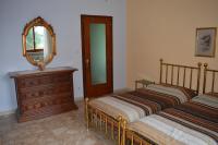 A bed or beds in a room at Villa Paulette