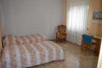 A bed or beds in a room at Villa Paulette