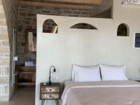 Posteľ alebo postele v izbe v ubytovaní VILLA SELINI LUXURY APARTMENT