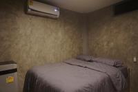 Postel nebo postele na pokoji v ubytování Chill loft โฮมเสตย์