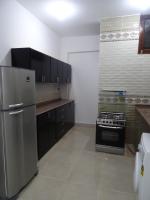 A kitchen or kitchenette at Nile Sunrise Flats