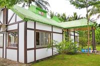 a small house with a green roof at Kaohsiung Meinong Rabbit Paul Homestay B&amp;B in Meinong