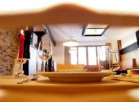 a plate of food sitting on a table with a candle at Das Geringer in Schladming