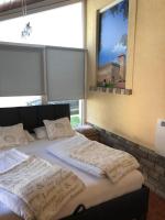 Posteľ alebo postele v izbe v ubytovaní Regina Delux Apartman